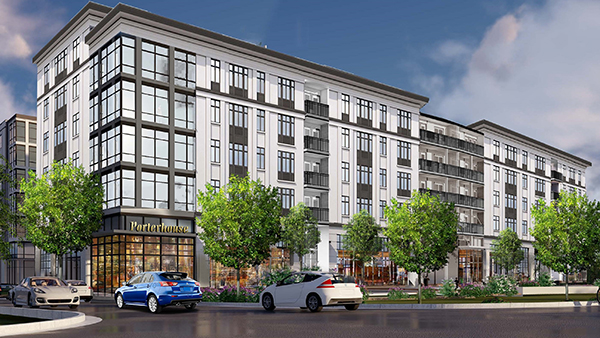 A pedestrian walks through Town Brookhaven, a mixed-use